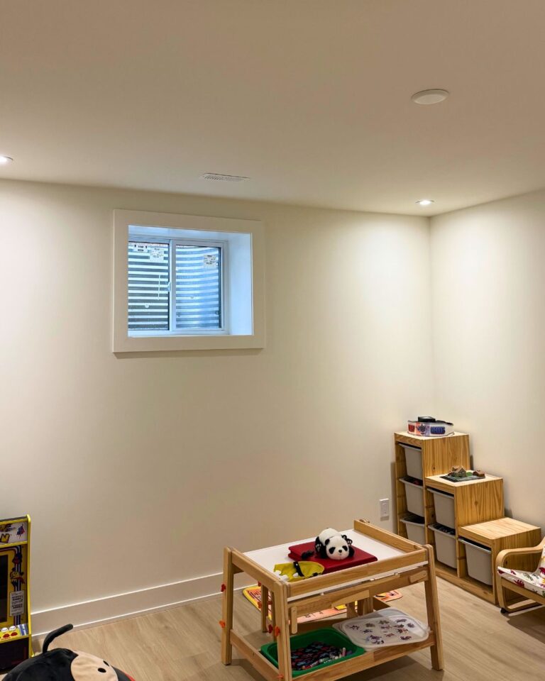 Finished basement room with pot lights