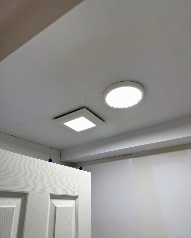 Bathroom ceiling with a new fan and LED light installed