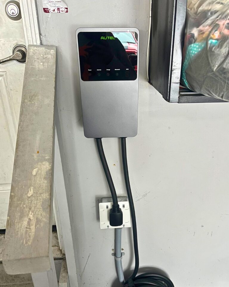 Wall-mounted EV charger installed in a garage