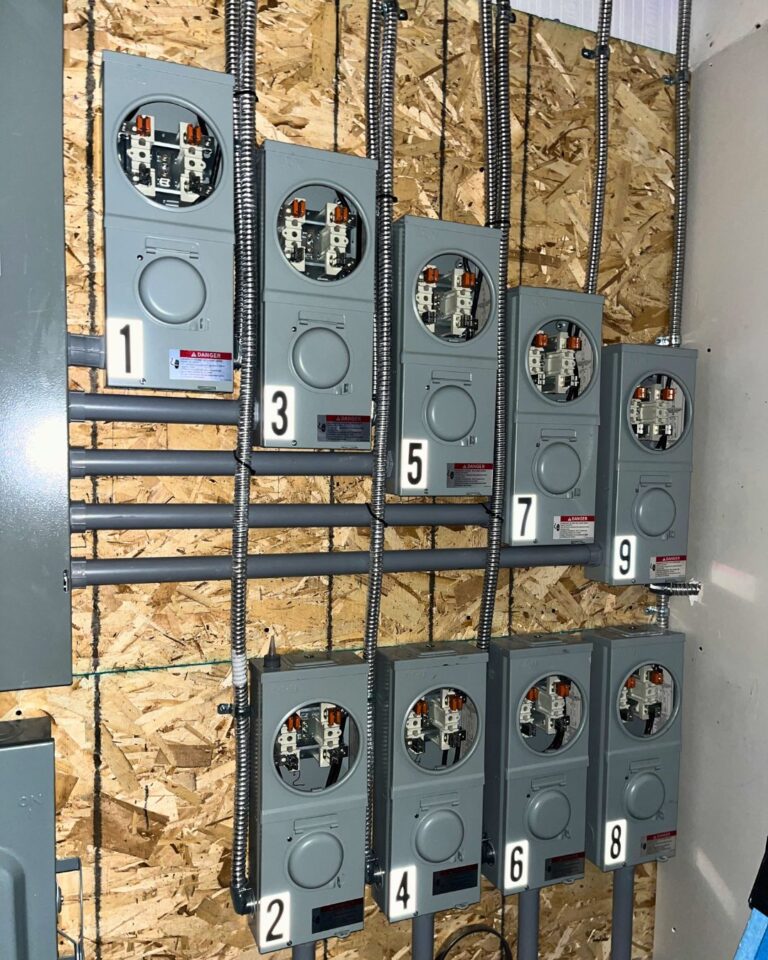 Numbered multi-unit meter bases installed during construction
