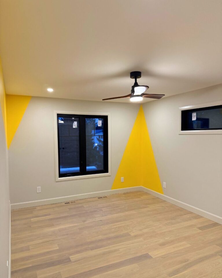 Bedroom with a ceiling fan and pot lights installed